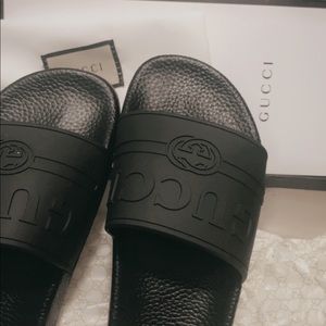 Black Gucci logo rubber slides sandals